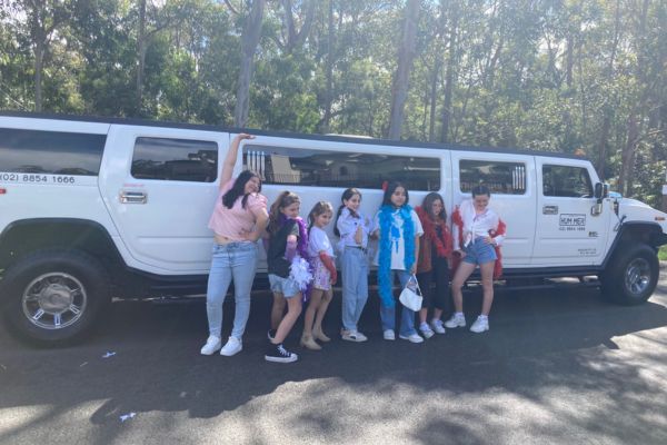 Stretch Hummer Party (4) Posing for photo with Stretch Hummer