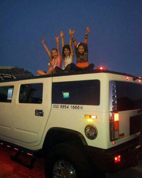 Hummer-Disco-Kids-Teen-Party (5) Posing for photo on top of Stretch Hummer